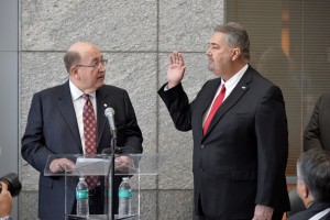 Former IAM International President Tom Buffenbarger, left, administers the oath of office to new International President Bob Martinez, Jr.